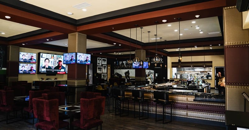 Tuscan Cove Bar & Patio bar seating area with TVs for game day