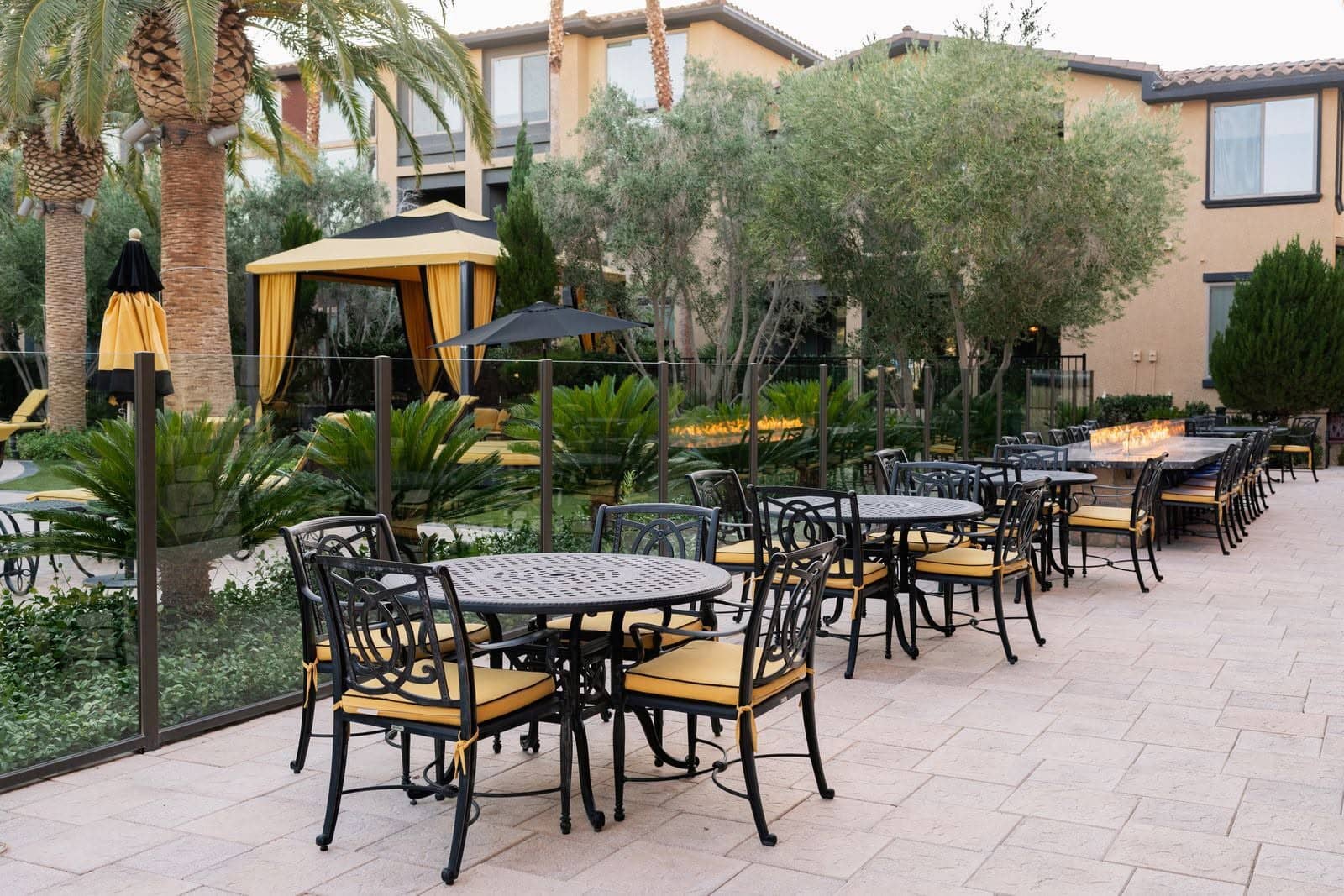 Poolside patio with fire tables and outdoor seating
