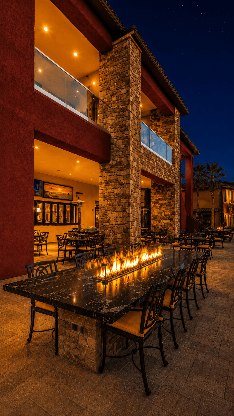 Tuscan Cove patio with fire table and evening courtyard seating